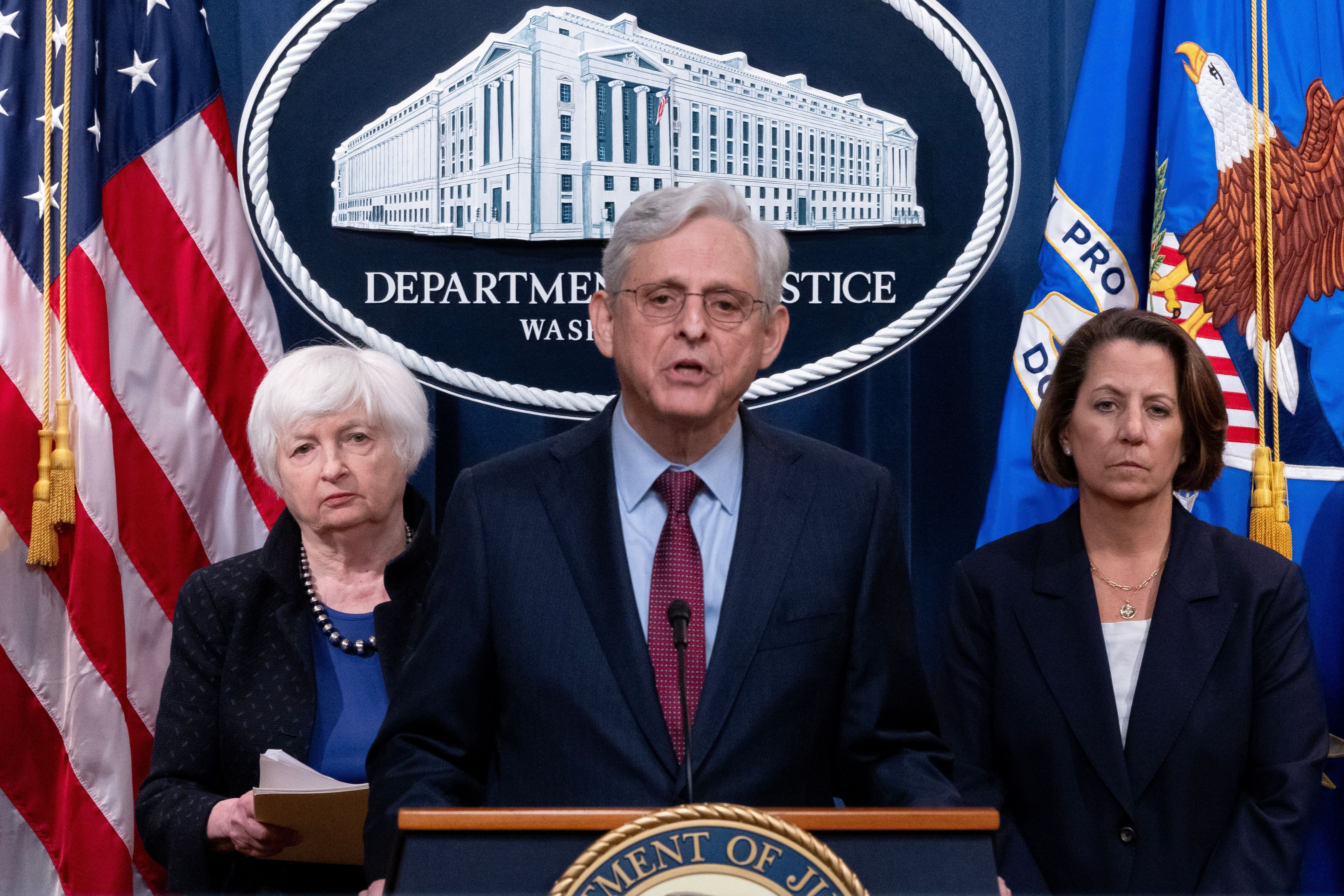 US Attorney General Merrick Garland (centre) is flanked by US Treasury Secretary Janet Yellen (left) and Deputy Attorney General Lisa Monaco at a press conference on November 21. Photo by MICHAEL REYNOLDS/EPA-EFE/Shutterstock 