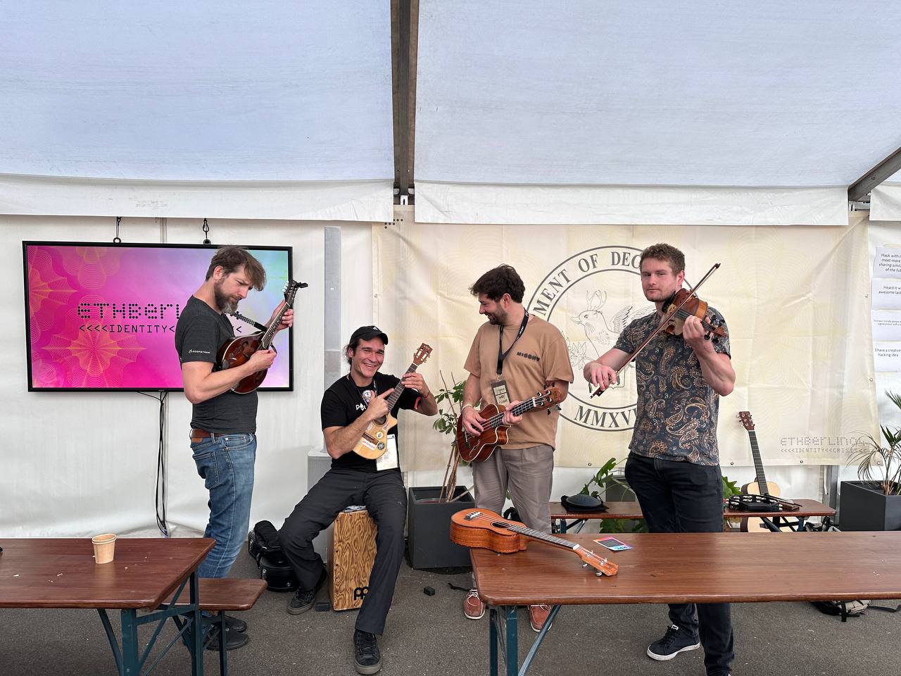 Volunteers and developers playing music at a hackathon in Berlin. Photocredit: ETHBerlin.