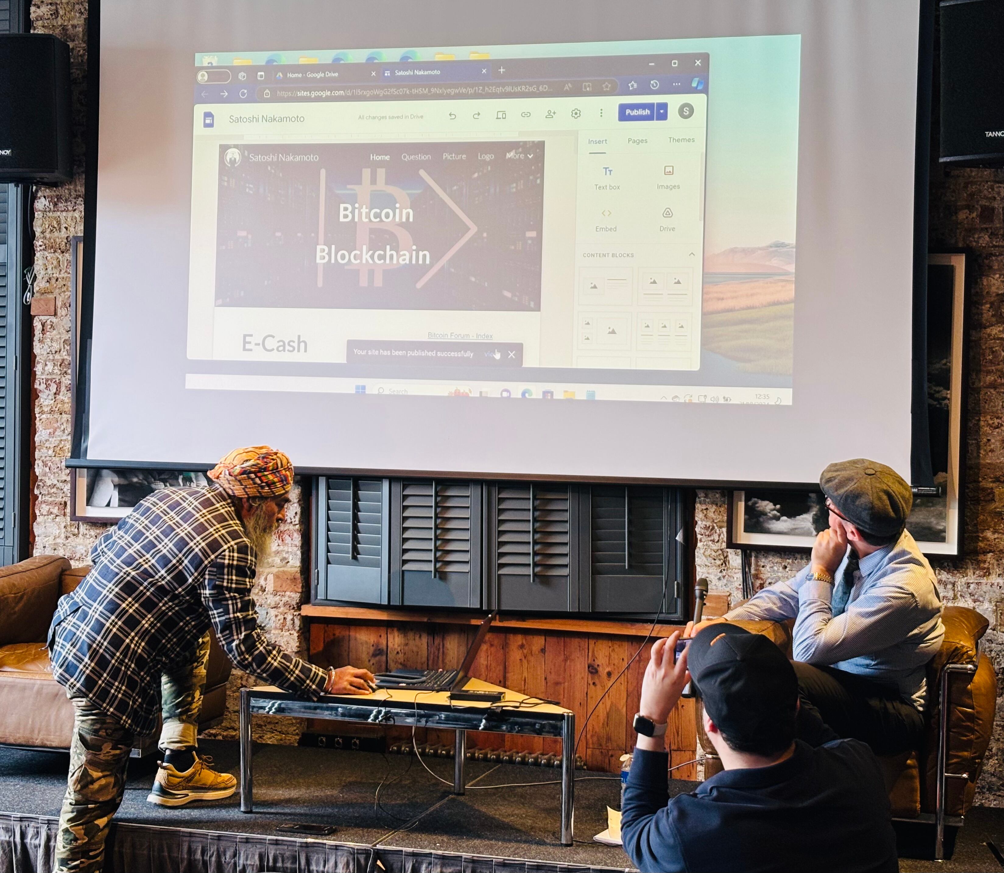 Stephen Mollah (left) shows what he says is evidence to support his claim he is Satoshi Nakamoto. Photo credit: Edward Robinson/ DL News